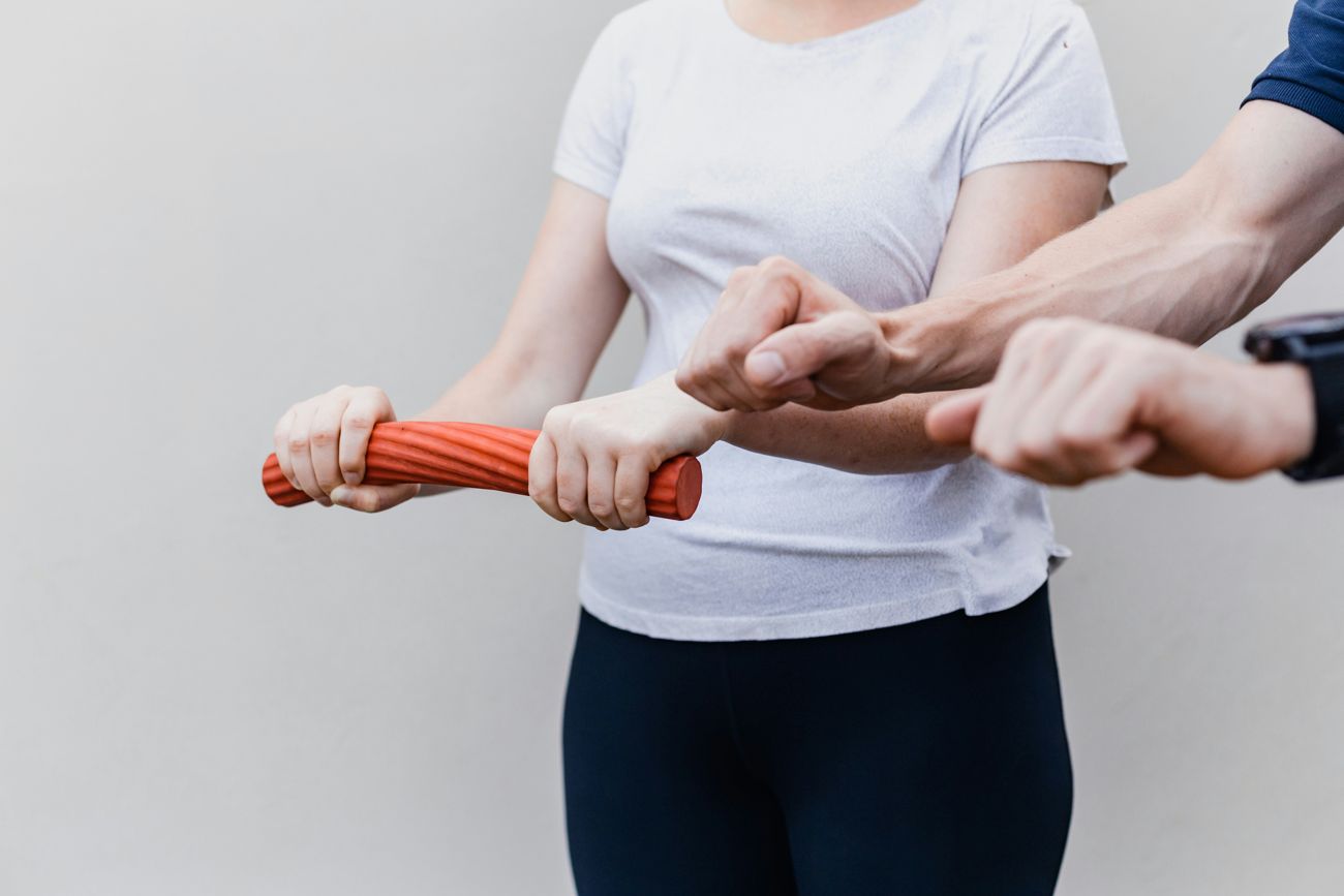 Physiotherapist assessing a patient's knee