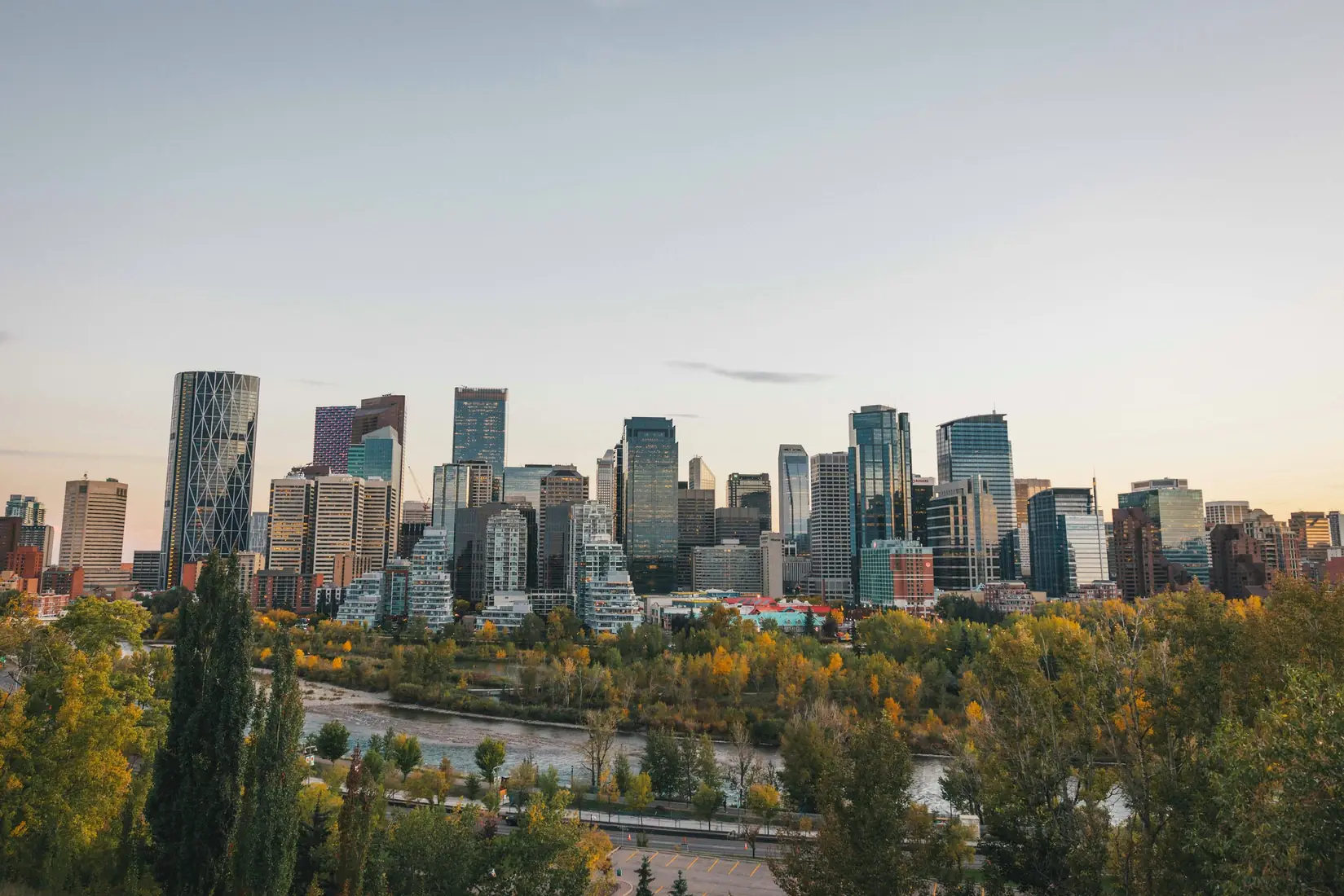 Calgary's downtown skyline above autumn trees