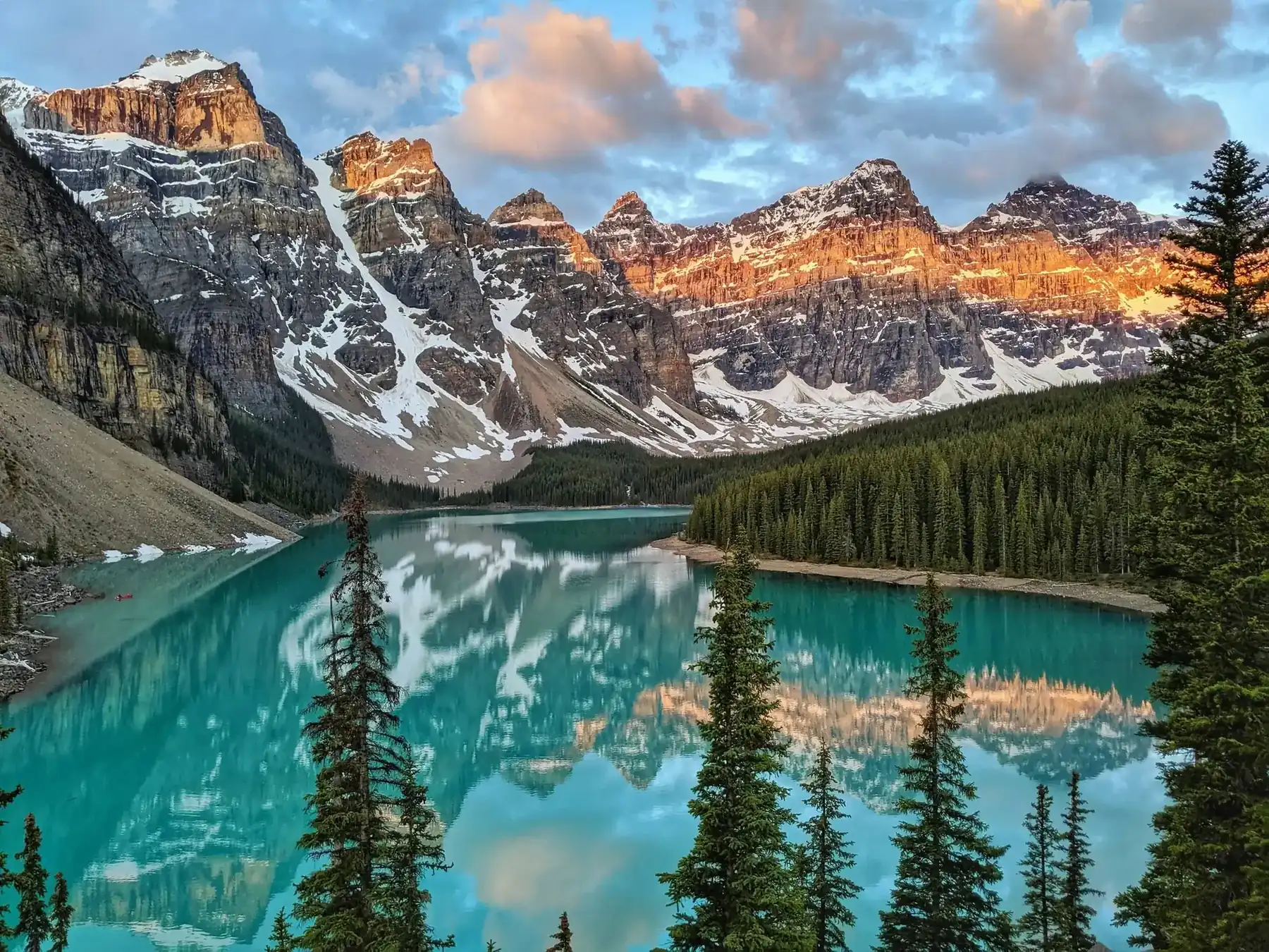 Turquoise Moraine Lake below snow-capped peaks